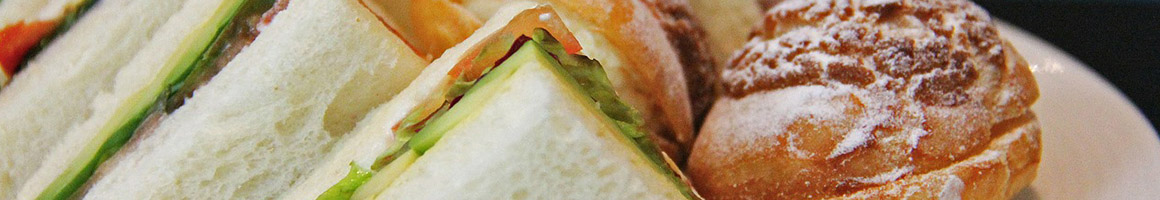 Eating Breakfast & Brunch Sandwich at Lotus Cafe restaurant in Ogden, UT.